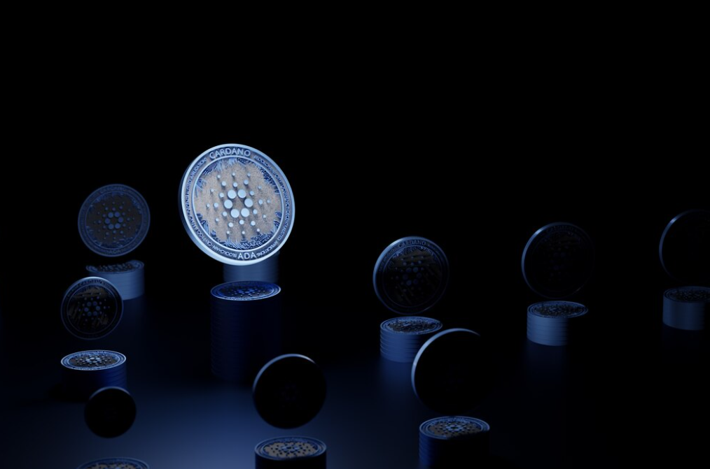 Cardano coins on the dark blue background, one coin highlighted with blue light