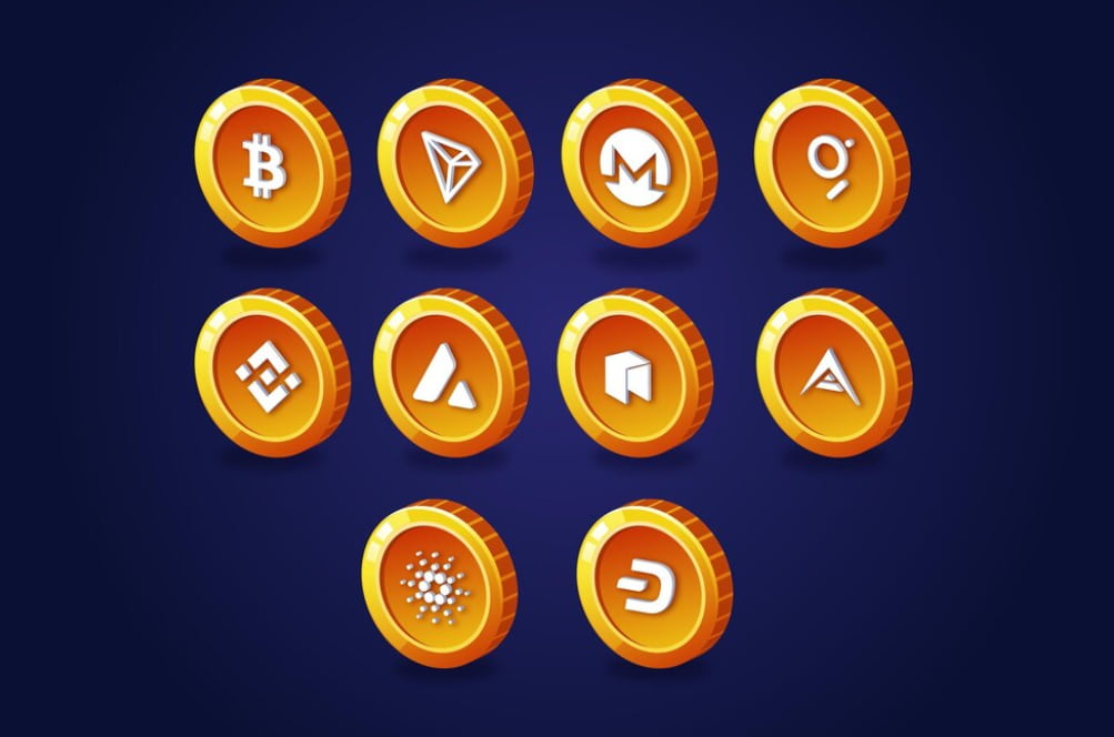 A collection of shiny cryptocurrency coins with various symbols
