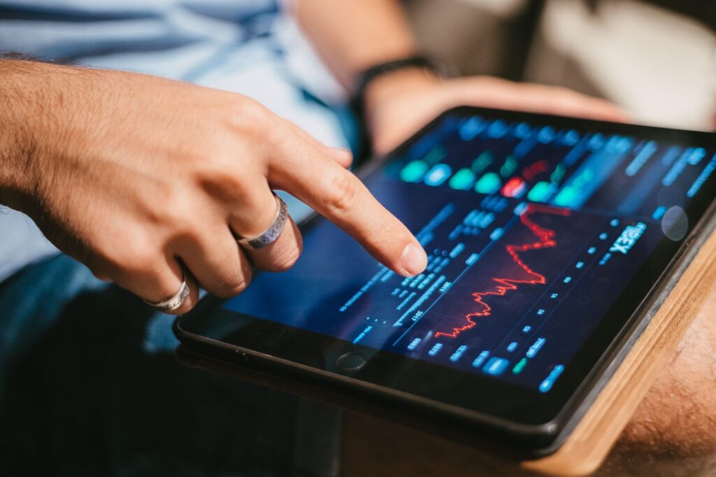 Man checking stock market data on tablet