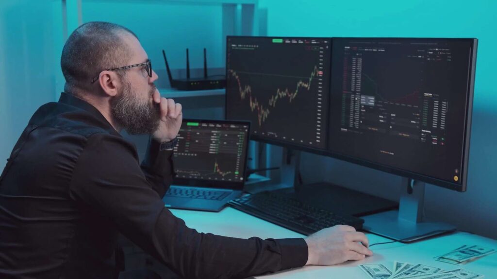 Man checking stock market data on computer
